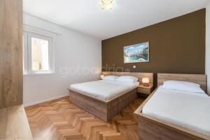 Postel nebo postele na pokoji v ubytování City Central Apartments Dolore