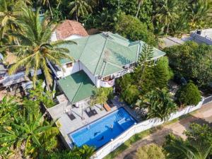an overhead view of a house with a swimming pool at Avon Villa in Hikkaduwa