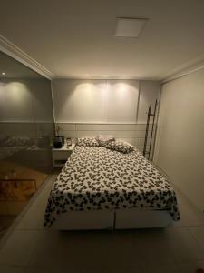 Cama o camas de una habitación en Loft luxo duplex com dois colchões adicionais e sofá cama