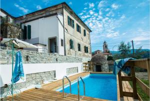 a villa with a swimming pool and a building at Monti Guesthouse in Monti di Licciana Nardi