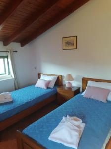 Postel nebo postele na pokoji v ubytování Mirmidones Corfu Apartment