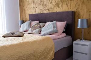 Posteľ alebo postele v izbe v ubytovaní APARTAMENT KAMILA