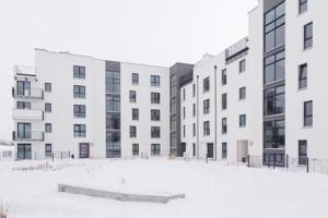 a row of buildings with a skateboard in the snow at APARTAMENT KAMILA in Gdańsk