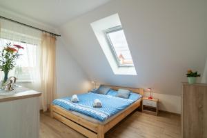 Uma cama ou camas num quarto em Frajárka