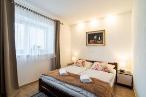 Uma cama ou camas num quarto em Frajárka