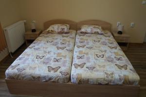 a bedroom with a bed with butterflies on it at Dessi in Pleven