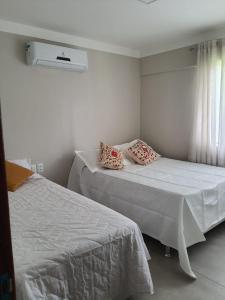 Ένα ή περισσότερα κρεβάτια σε δωμάτιο στο Flat em Genipabu Summer House +26 φωτογραφίες