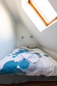 a bedroom with a bed in a attic at Bryza Sopot in Sopot