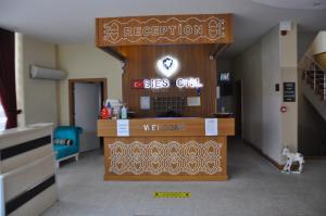 a reception desk in a hospital room with a dog at SİES OTEL in Antalya