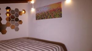 Postel nebo postele na pokoji v ubytování I Fiori nel golfo di Baratti