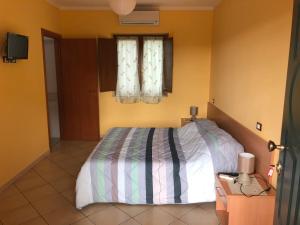 a bedroom with a bed and a window at B&B Le Fravette in Fuscaldo +28 photos