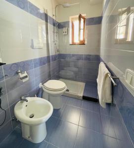 Et badeværelse på Sdraiati Apartments - Bed & Breakfast - Pollica