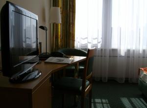 TV a/nebo společenská místnost v ubytování Superior Hotel Präsident