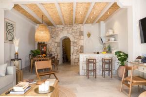 a living room with a stone wall at Casas de San Pedro in Hita