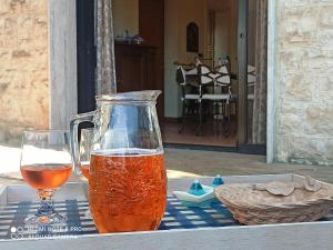 a pitcher and a glass of beer on a table at Villa Rossi in Polignano a Mare