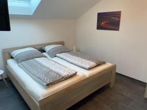 Postel nebo postele na pokoji v ubytování Gästehaus Veenstra