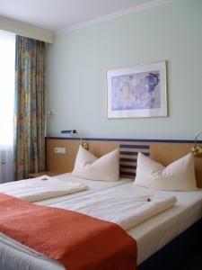 Postel nebo postele na pokoji v ubytování Superior Hotel Präsident