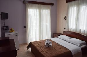Postel nebo postele na pokoji v ubytování Filippion Hotel