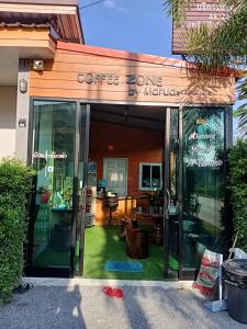 a coffee cone by nature store with its doors open at Maruay in Suratthani