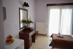 Postel nebo postele na pokoji v ubytování Filippion Hotel