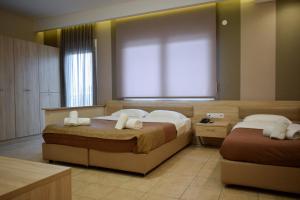Postel nebo postele na pokoji v ubytování Filippion Hotel