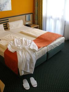 Postel nebo postele na pokoji v ubytování Superior Hotel Präsident