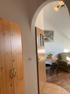 a living room with a mirror and a table at Villa Remedios in Łeba