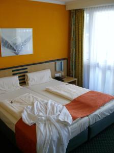 Postel nebo postele na pokoji v ubytování Superior Hotel Präsident