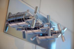 a close up of a metal object on a wall at Malmaison London in London