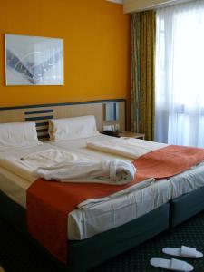 Postel nebo postele na pokoji v ubytování Superior Hotel Präsident