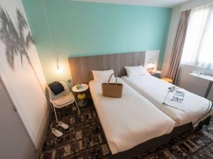 Llit o llits en una habitació de Ibis Styles Nice Centre Gare