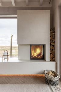 a fireplace in a living room with a fire place at Radar by Bloom Stays in Littlestone-on-Sea