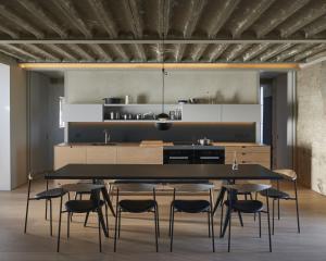 a dining room with a black table and chairs at Pump Station by Bloom Stays in Littlestone-on-Sea