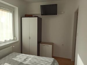 Postel nebo postele na pokoji v ubytování La Siesta Bogács Apartman