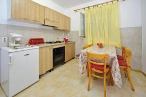 Kuchyň nebo kuchyňský kout v ubytování Guest House Villa Jadera