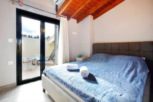 Posteľ alebo postele v izbe v ubytovaní Anemomilos Casa ideale 1st floor