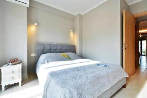 Posteľ alebo postele v izbe v ubytovaní Anemomilos Casa ideale 1st floor