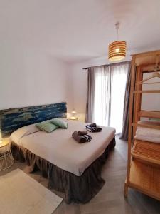 A bed or beds in a room at Comfortable House in Formentera with Garden and Terrace