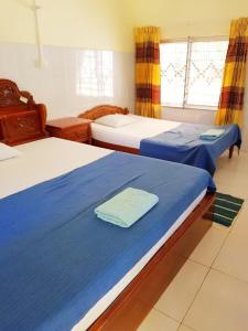 A bed or beds in a room at Meas Family Homestay