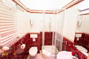Łazienka w obiekcie Baltic Apartments - Apartamenty Korony Piastów
