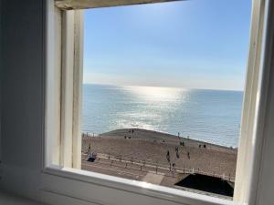 a view of a beach from a window at The Bank Hotel & Bistro in Hastings