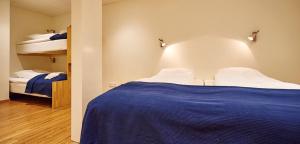 Postel nebo postele na pokoji v ubytování Fridas Hotell