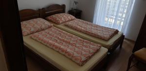 Posteľ alebo postele v izbe v ubytovaní Apartments Stojanović