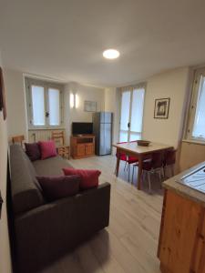 a living room with a couch and a table at Al Ponte Nuovo in Ponte di Legno