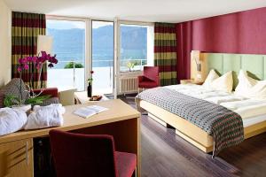 Ένα ή περισσότερα κρεβάτια σε δωμάτιο στο Hotel Alexander