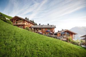 a house on the side of a hill at HochLeger - Chalet Refugium am Berg in Aschau