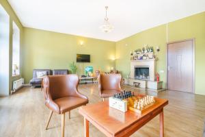 a living room with a chess board on a table at Pushkin 10 Hostel in Tbilisi City