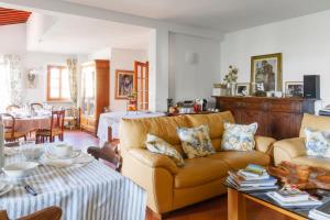 a living room with a couch and a table at Rosso Del Chianti in Panzano