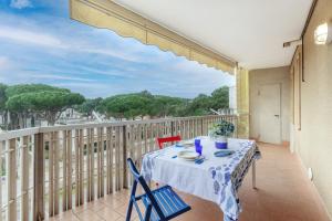 a table and chairs on a balcony with a view at Lido di Spina vista mare pineta - A Casa di Alessandra in Lido di Spina +39 photos