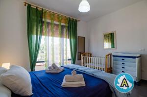 Кровать или кровати в номере Appartamento Centrale a Silvi Marina